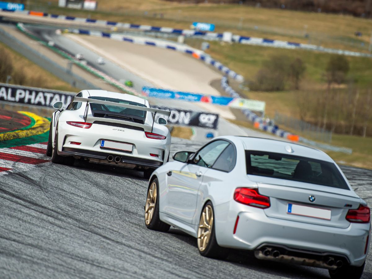 Cars racing on track