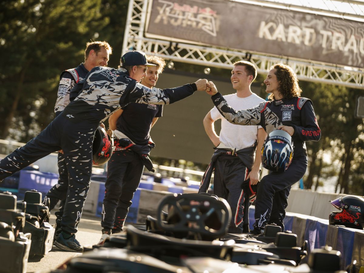 Kart team high fiving