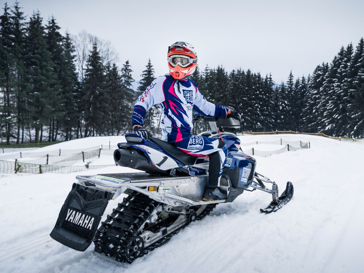 Snowmobil practicing on a snowy track