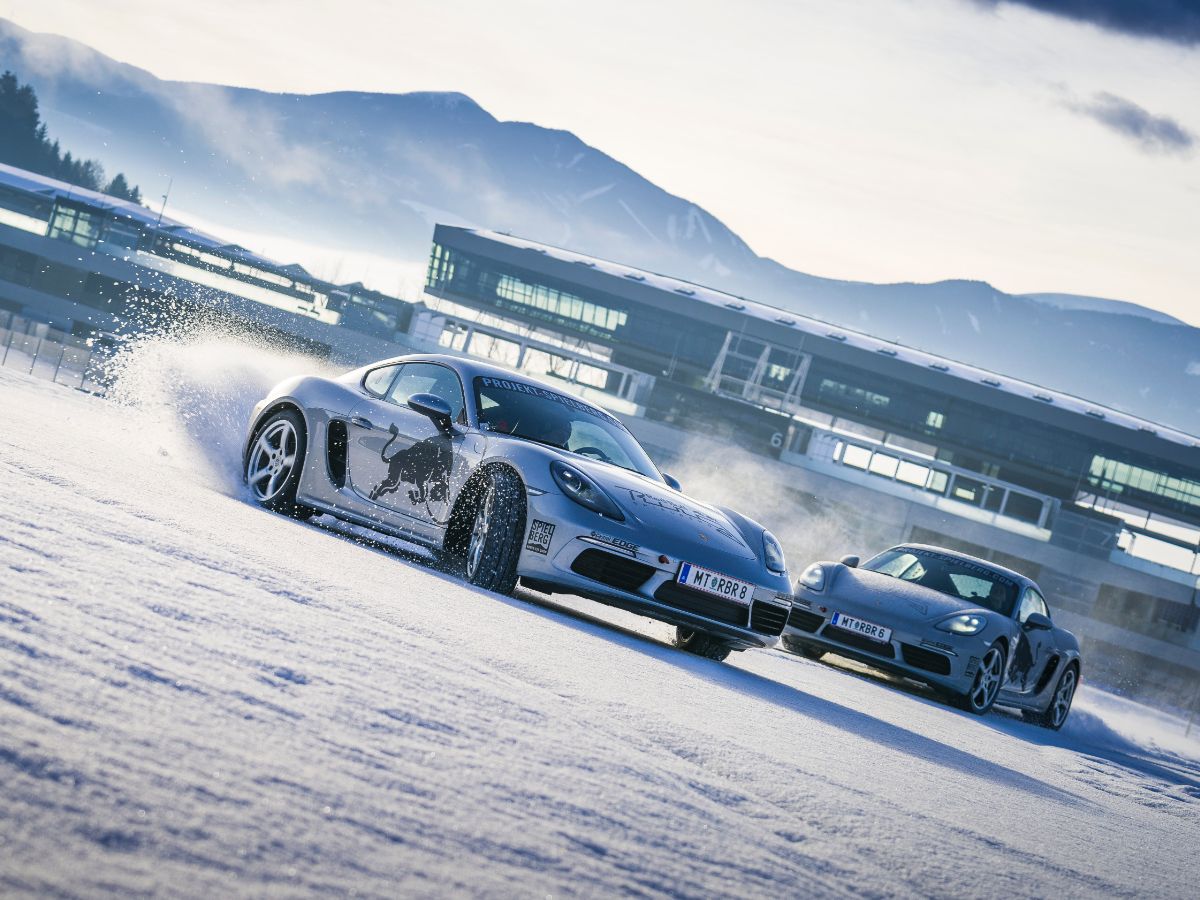 Two Porsche 718 Cayman S drifting  on track
