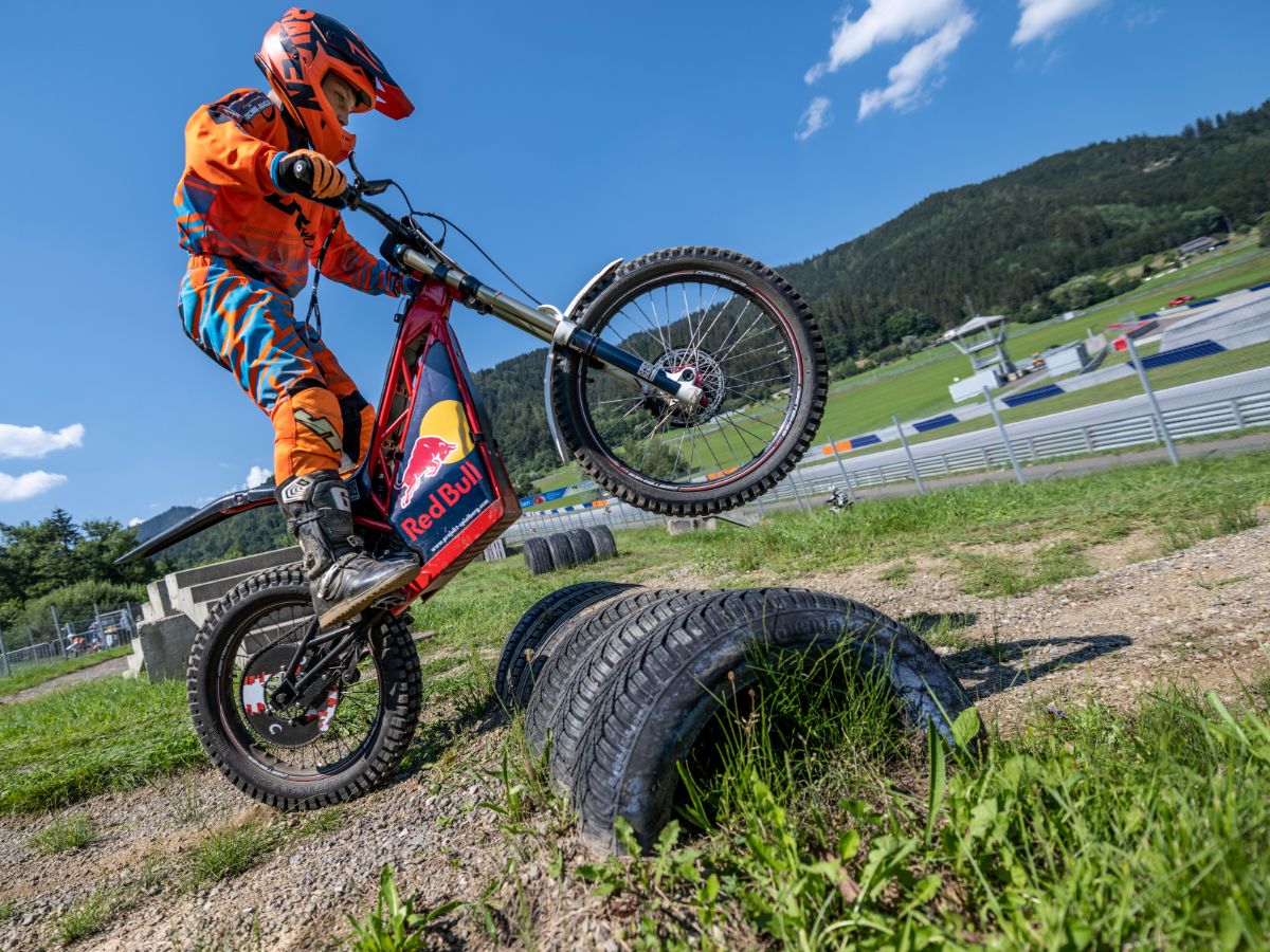 Trial Bike driving over tyre-obstacle